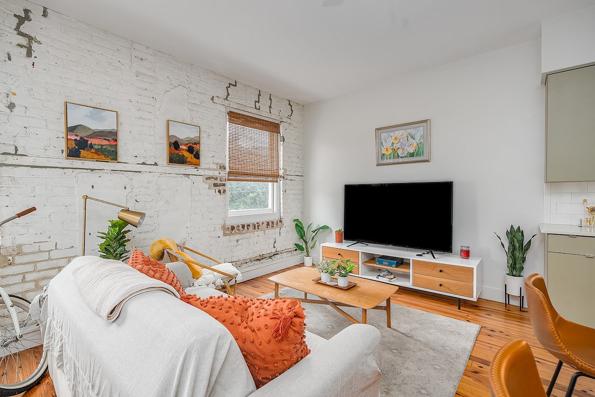 Peach Bum living room with exposed brick and warm peach accents